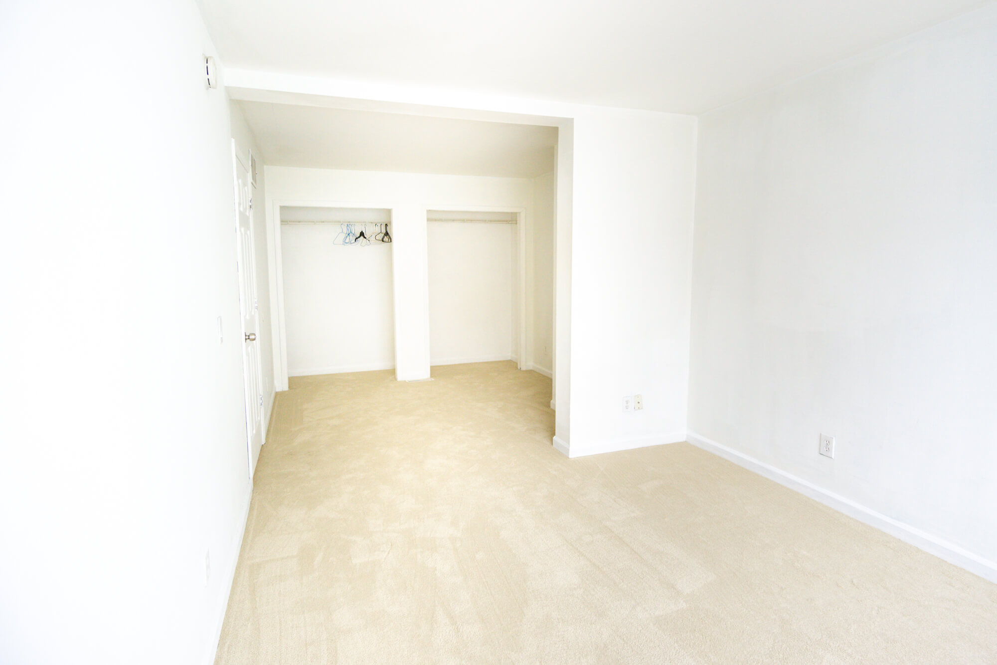 First floor double bedroom facing the two closets from further away.