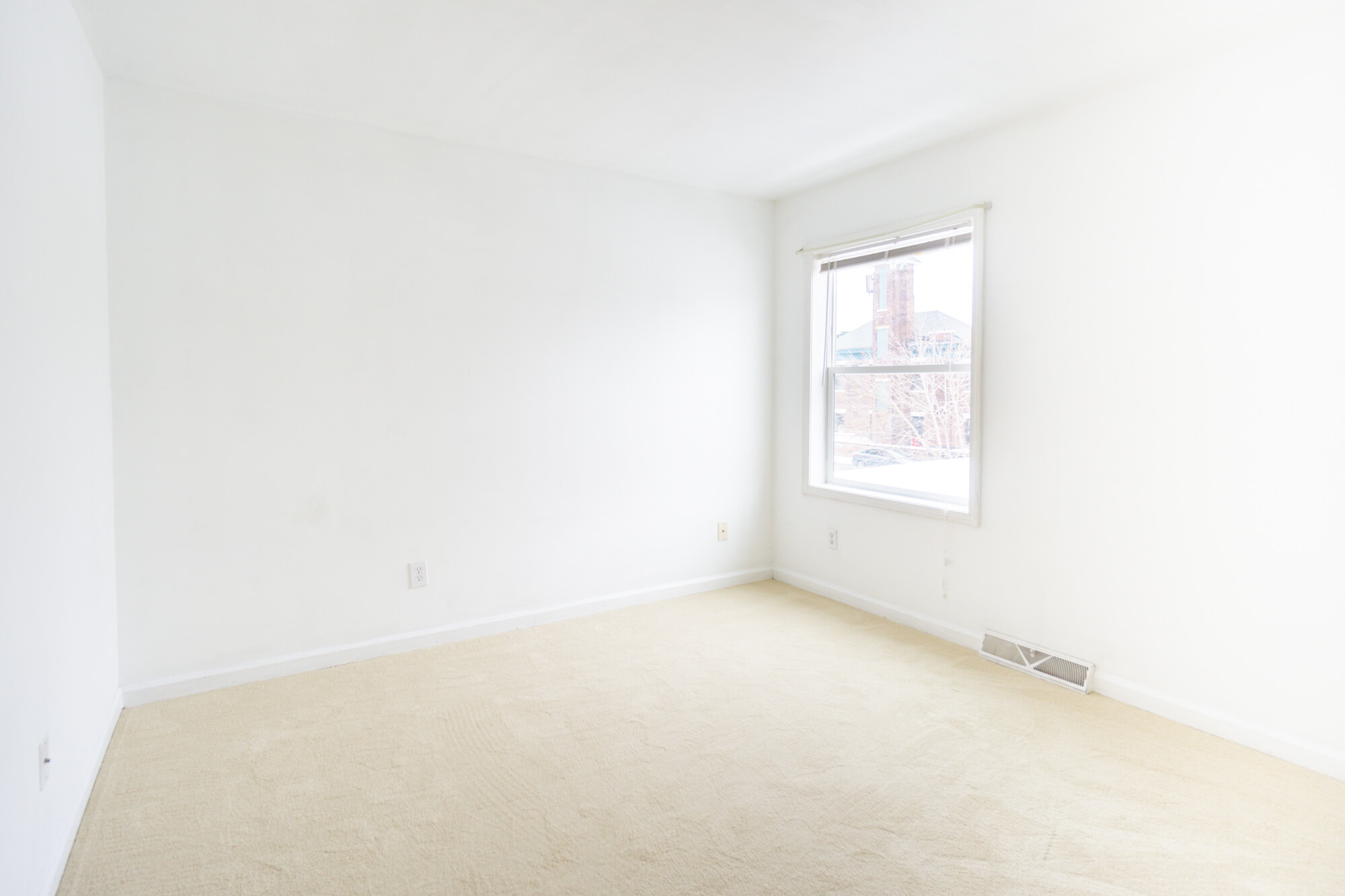 Second floor single bedroom with a window.